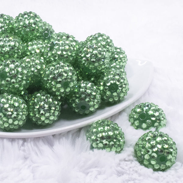 front view of a pile of 20mm Grass Green with Clear Rhinestone Bubblegum Beads
