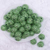 top view of a pile of 20mm Grass Green with Clear Rhinestone Bubblegum Beads