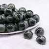 front view of a pile of 20mm Green Camoflauge Acrylic Bubblegum Beads