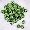top view of a pile of 20mm Green and Black Plaid Print Bubblegum Beads