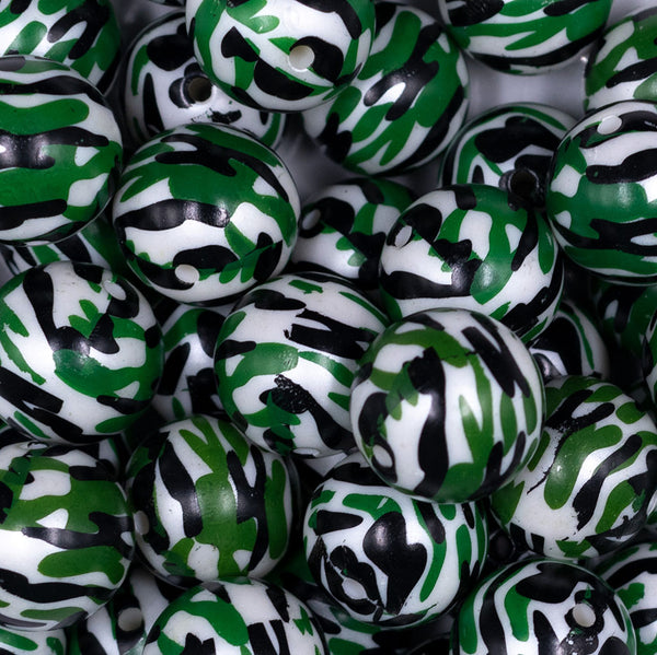 Close up view of a pile of 20mm Green, Black & White Camo Acrylic Bubblegum Beads