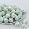 Front view of a pile of 20mm Green Butterfly pattern chunky acrylic Bubblegum Beads