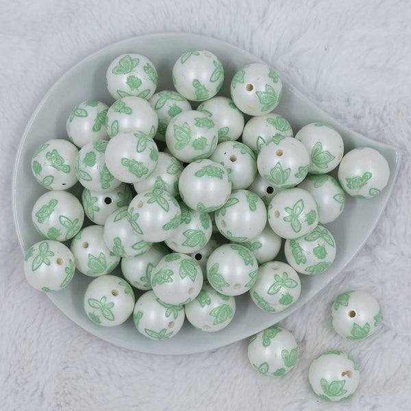 Top view of a pile of 20mm Green Butterfly pattern chunky acrylic Bubblegum Beads
