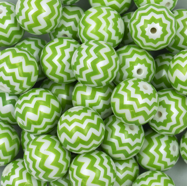 Close up view of a pile of 20mm Green with Matte White Chevron Bubblegum Beads