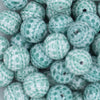 Close up view of a pile of 20mm Green Christmas Print Acrylic Bubblegum Beads