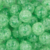 Close up view of a pile of \20mm Green Crackle Bubblegum Beads