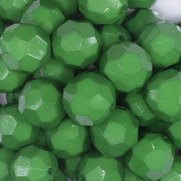 close up view of a pile of 20mm Green Faceted Opaque Bubblegum Beads