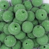 Close up view of a pile of 20mm Green Sugar Glass Bubblegum Beads