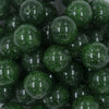 Close up view of a pile of 20mm Green Glitter Sparkle Chunky Acrylic Bubblegum Beads