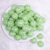 top view of a pile of 20mm Lime Green Majestic Confetti Bubblegum Beads