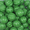 close up view of a pile of 20mm Green Opaque Pumpkin Shaped Bubblegum Bead