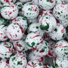 Close up view of a pile of 20mm Red & Green Splatter Chunky Acrylic Bubblegum Beads