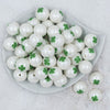 Top view of a pile of 20mm Green Shamrock Clover on matte white Chunky Bubblegum Beads