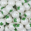 Close up view of a pile of 20mm Green Shamrock Clover on matte white Chunky Bubblegum Beads