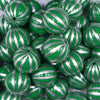 Close up view of a pile of 20mm Green with Silver Pin Stripes Acrylic Bubblegum Beads
