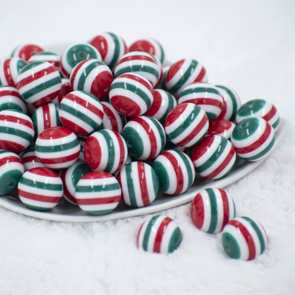 Front view of a pile of 20mm Red & Green multi Stripe Acrylic Chunky Bubblegum Beads