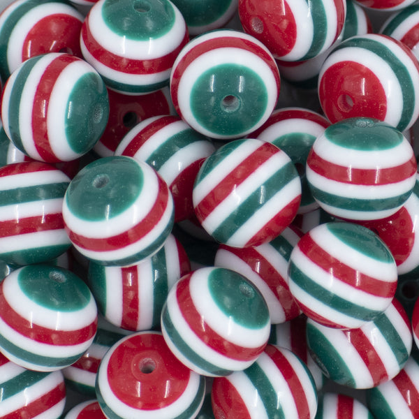 Close up view of a pile of 20mm Red & Green multi Stripe Acrylic Chunky Bubblegum Beads