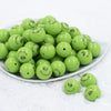 Front view of a pile of 20mm Grinch Smirk Face Print Chunky Acrylic Bubblegum Beads [10 Count]
