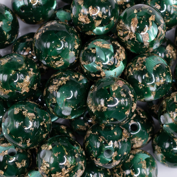 close up view of a pile of 20mm Green and Gold Flake Resin Chunky Bubblegum Beads
