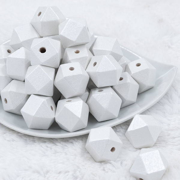 Front view of a pile of 20mm White Painted Hexagon Wooden Beads