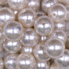 Close up view of a pile of 20mm Ivory with Glitter Faux Pearl Bubblegum Beads