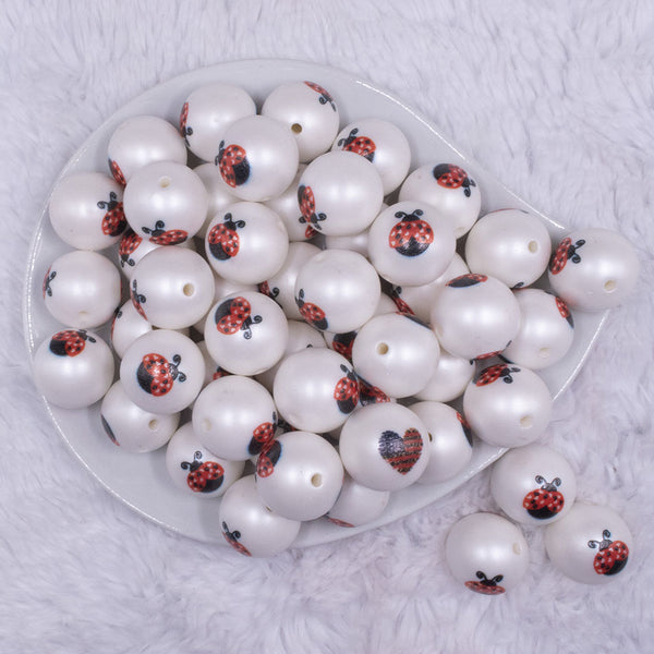 top view of a pile of 20mm Ladybug print on Matte White Acrylic Bubblegum Beads