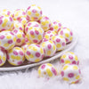 front view of a pile of 20mm Lemon Fruit print on Matte White Acrylic Bubblegum Beads