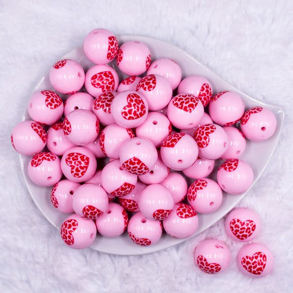 Top view of a pile of 20mm Pink with Red Leopard Print Heart Chunky Acrylic Bubblegum Beads [10 Count]