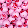Close up view of a pile of 20mm Pink with Red Leopard Print Heart Chunky Acrylic Bubblegum Beads [10 Count]