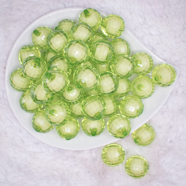 top view of a pile of 20mm Lime Green Translucent Faceted Bead in a bead Bubblegum Bead