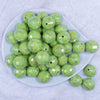 top view of a pile of 20mm Lime Green Disco Faceted AB Bubblegum Beads