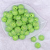 Top view of a pile of 20mm Lime Green Flower Rhinestone Bubblegum Beads
