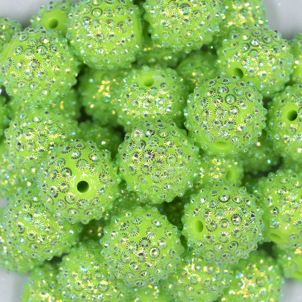 Close up view of a pile of 20mm Lime Green Flower Rhinestone Bubblegum Beads