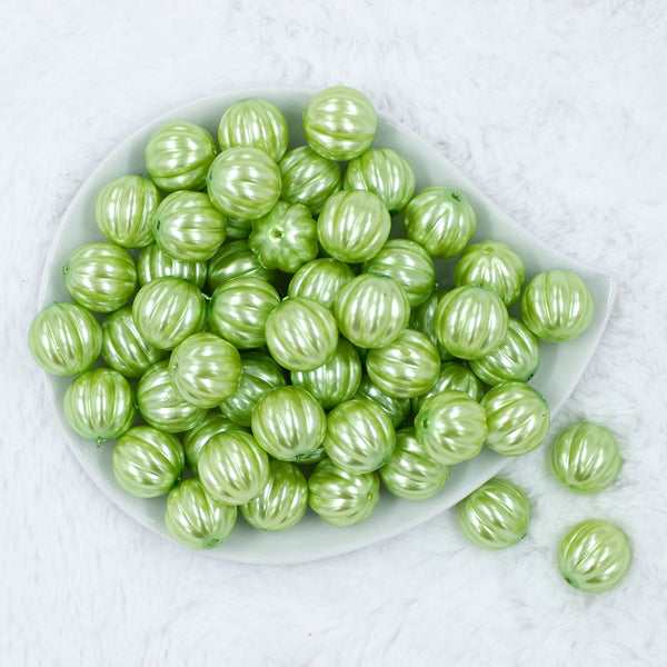 Top view of a pile of 20mm Lime Green Pearl Pumpkin Shaped Bubblegum Bead