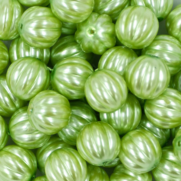 Close up view of a pile of 20mm Lime Green Pearl Pumpkin Shaped Bubblegum Bead