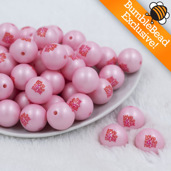 Front view of a pile of 20mm Love Is In The Air Print Chunky Acrylic Bubblegum Beads [10 Count]
