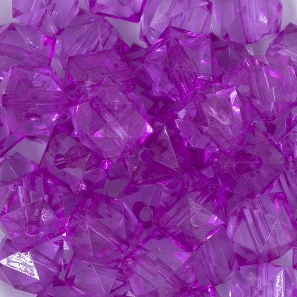 Close up view of a pile of 20mm Magenta Purple Transparent Cube Faceted Bubblegum Beads