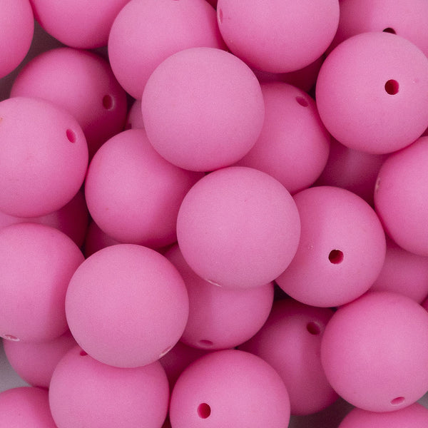 Close up view of a pile of 20mm Bubblegum Pink Matte Solid Bubblegum Beads