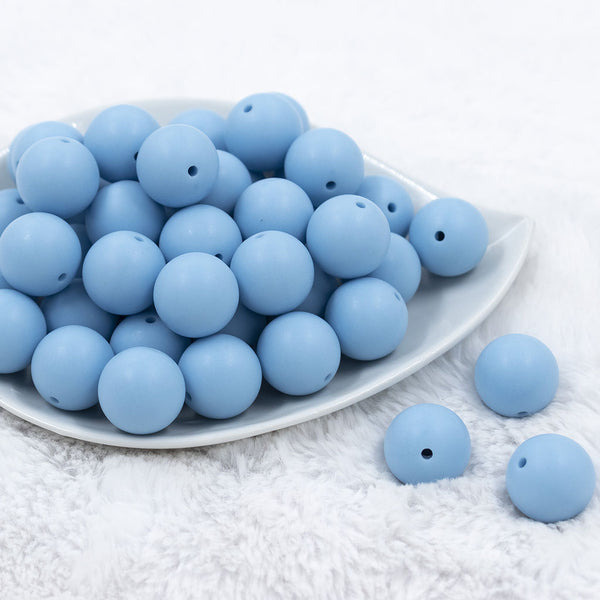 Front view of a pile of 20mm Cornflower Blue Matte Solid Bubblegum Beads