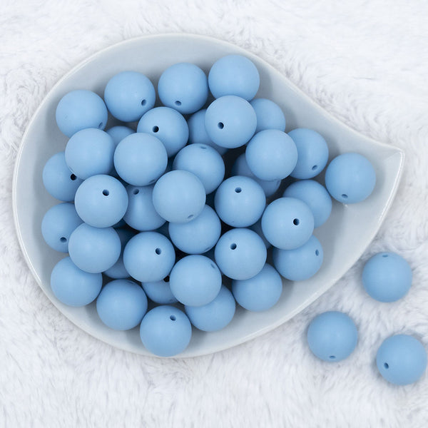 Top view of a pile of 20mm Cornflower Blue Matte Solid Bubblegum Beads