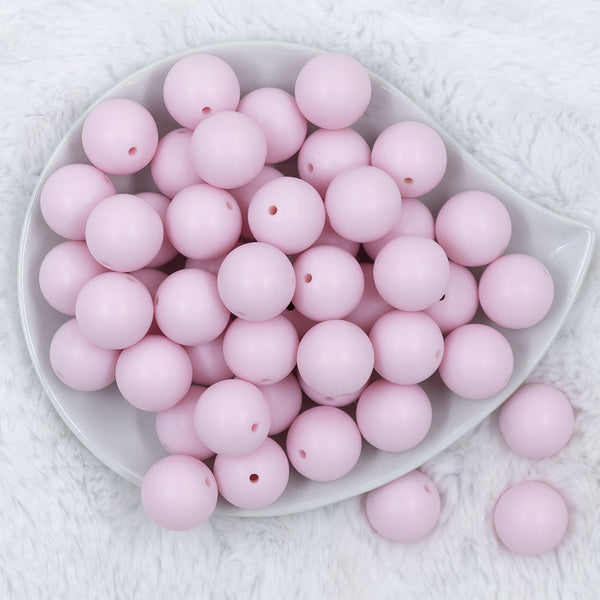 Top view of a pile of 20mm Cotton Candy Pink Matte Solid Bubblegum Beads
