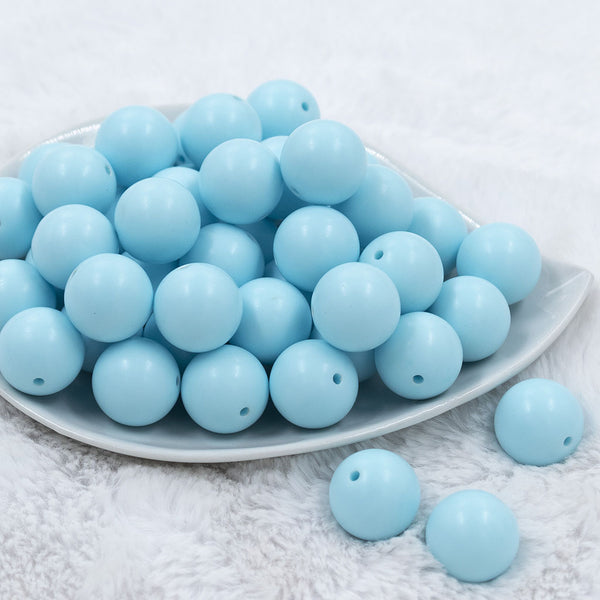 Front view of a pile of 20mm Ice Blue Matte Solid Bubblegum Beads