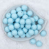 Top view of a pile of 20mm Ice Blue Matte Solid Bubblegum Beads