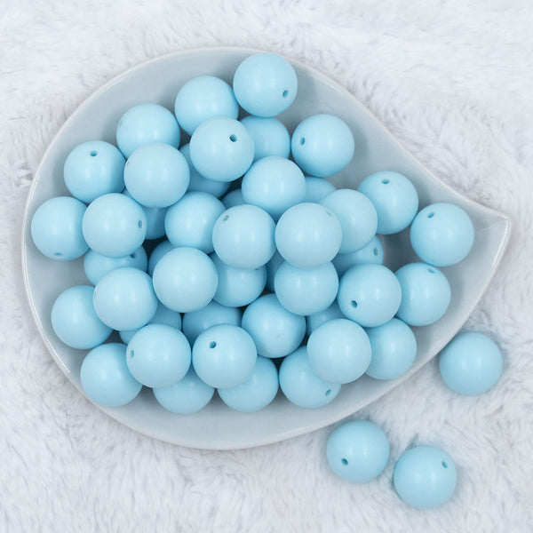 Top view of a pile of 20mm Ice Blue Matte Solid Bubblegum Beads