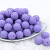 Front view of a pile of 20mm Iris Purple Matte Solid Bubblegum Beads