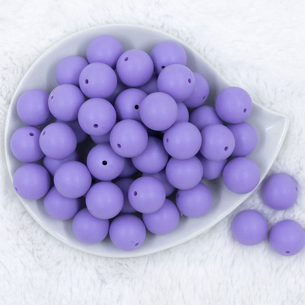 Top view of a pile of 20mm Iris Purple Matte Solid Bubblegum Beads