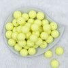 Top view of a pile of 20mm Yellow Matte Solid Bubblegum Beads