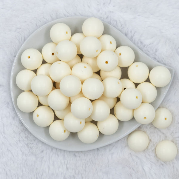 Top view of a pile of 20mm Off White Matte Solid Bubblegum Beads