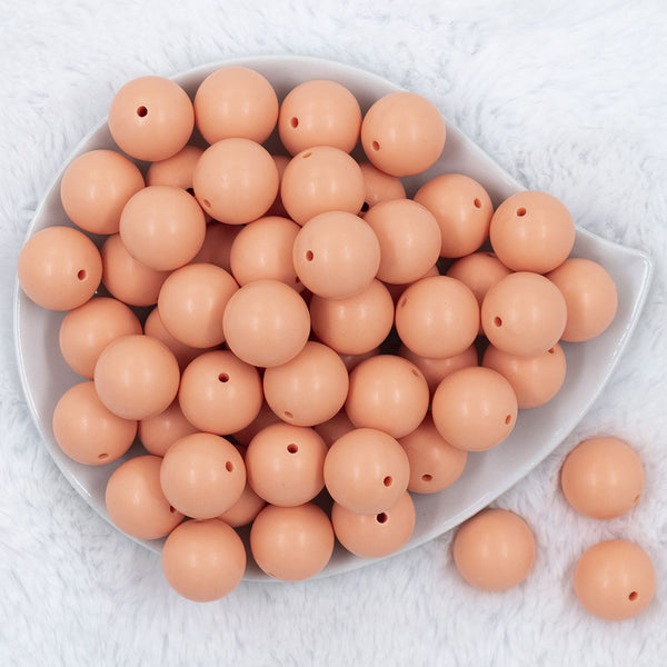 Top view of a pile of 20mm Peach Matte Solid Bubblegum Beads