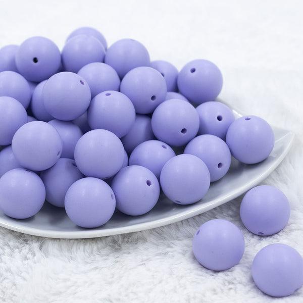Front view of a pile of 20mm Periwinkle Purple Matte Solid Bubblegum Beads